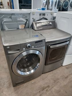 LG gray front load washer and GAS dryer set