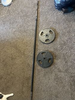 Pair Of 25 lb Plates And 7ft Barbell