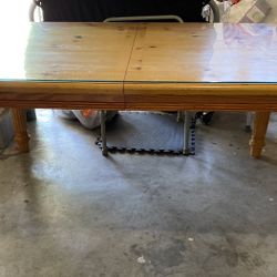 Very sturdy dining table with protection top glass and extra leaf