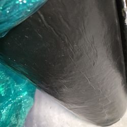 Coated underbelly material insulated