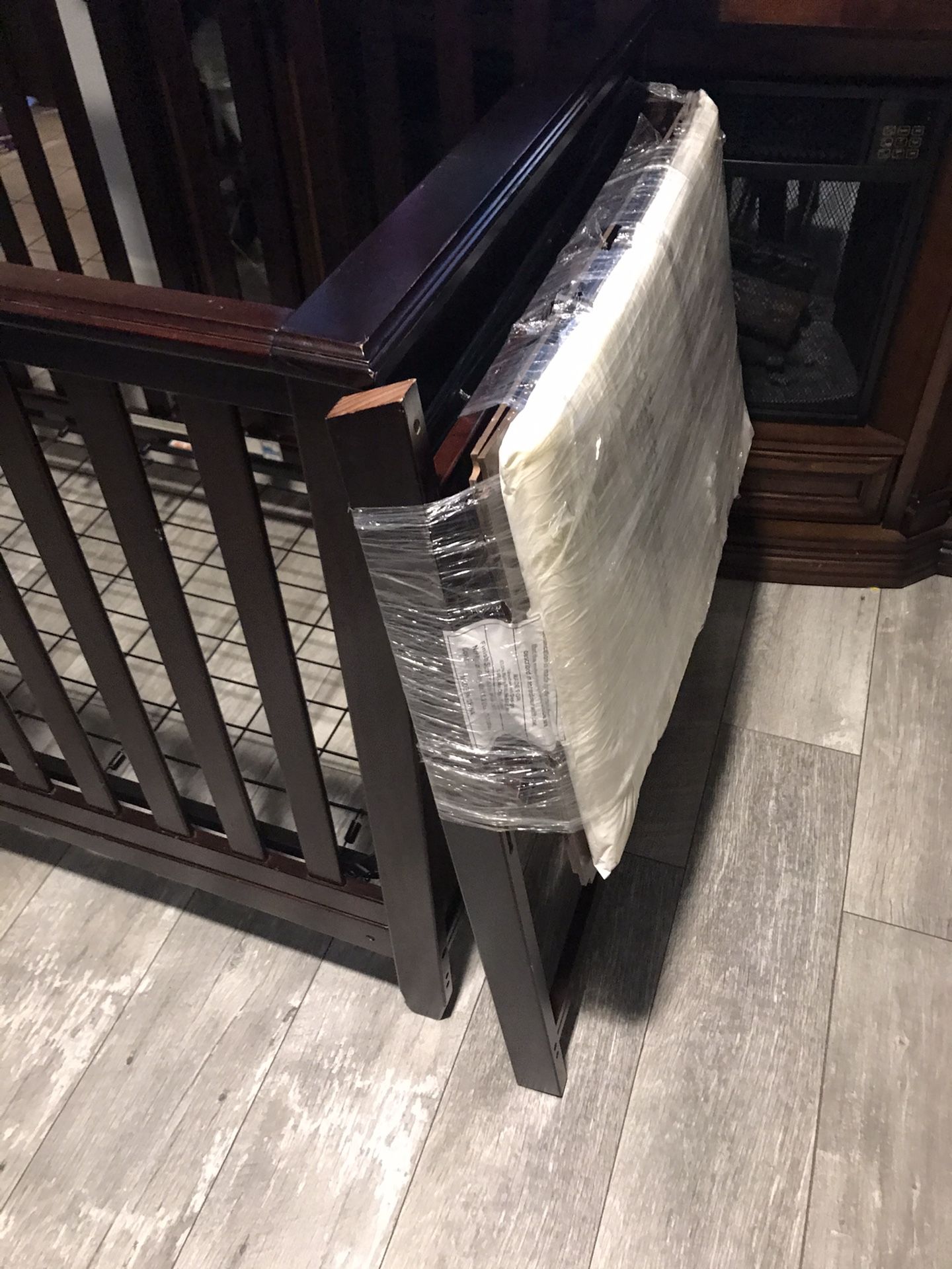 Baby crib with changing table