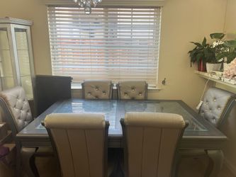 Dining table with 6 chairs with some scuffs