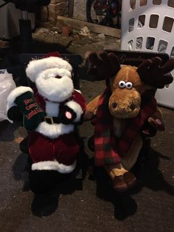 Singing santa and reindeer in a rocking chair