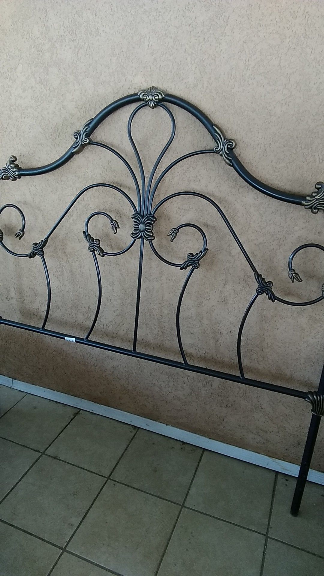 Queen size, wrought iron headboard.