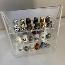  Vintage collection of thimbles in a three-tier acrylic display case