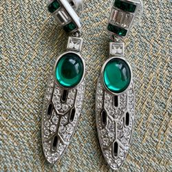 Vintage, circa unknown, designed earrings signed and designed by V&A Museum Shops. Featuring faux green cabochons accented both green and white crysta