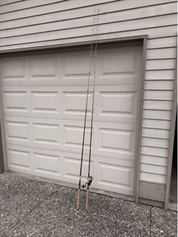 Two Okuma SST Salmon Spin Rods with one Penn Battle 4000 Reel