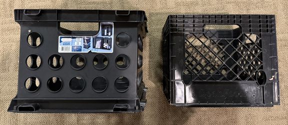 Two plastic storage crates with handles (Sterilite and Dean Foods).