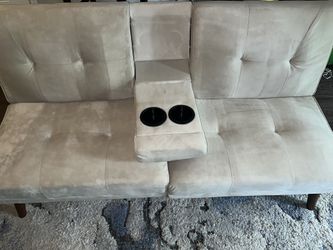 Tan futon sofa/w cupholders