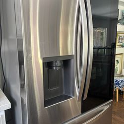 Practically new LG stainless steel side by side and bottom freezer smart refrigerator