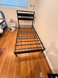 Twin bed frame with charging station and LED lights