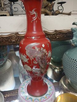 vintage red vase featuring intricate mother-of-pearl inlay