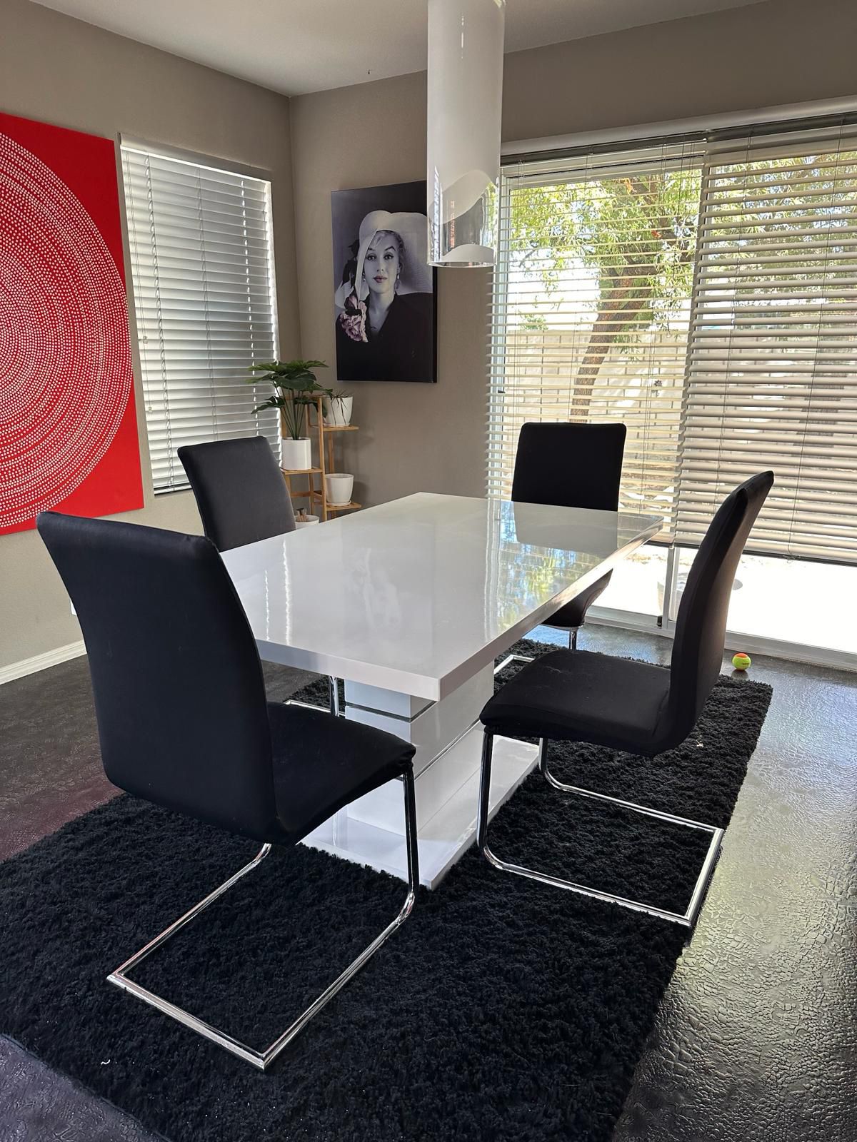 Contemporary dining table with 4 black chairs And Covers