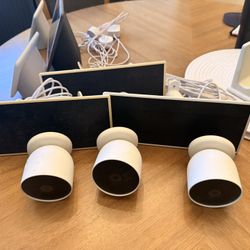 3 Google Nest Cam (Battery) cameras plus 3 solar panels