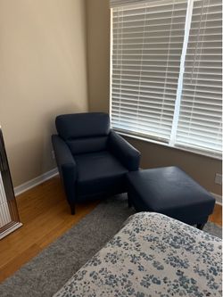 Blue leather chair and ottoman.