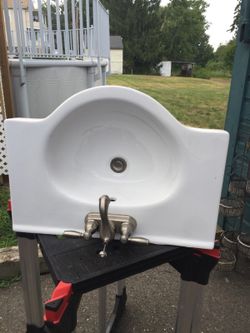 Bathroom sink with the Peerless faucet