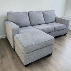 REVERSIBLE GREY SECTIONAL COUCH ***FREE DELIVERY ***