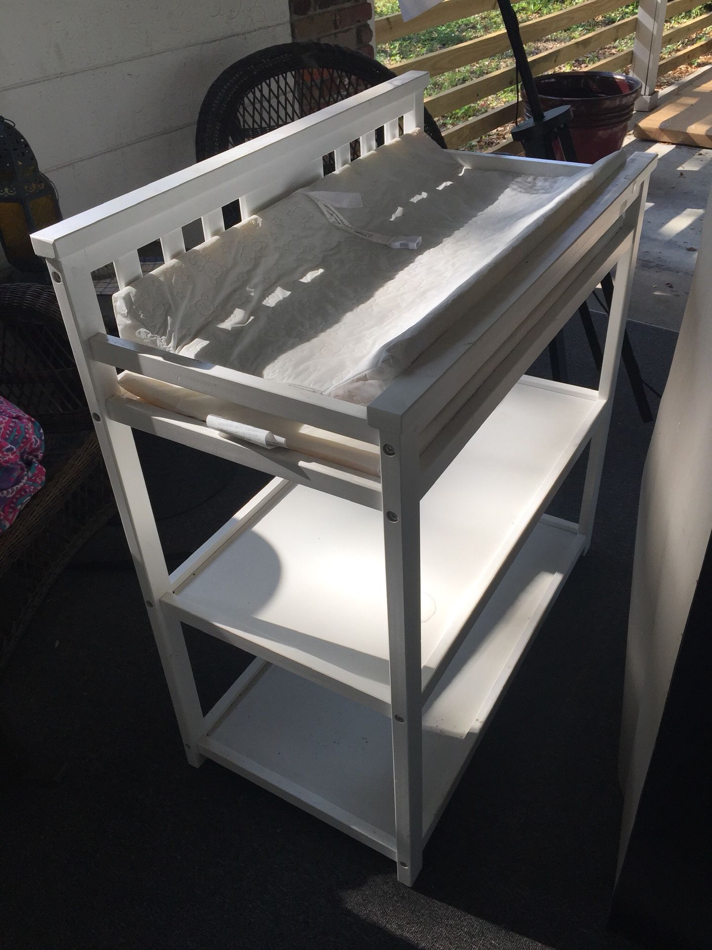 Beautiful white changing table and changing pad