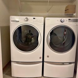 Front load washer and dryer with pedestals