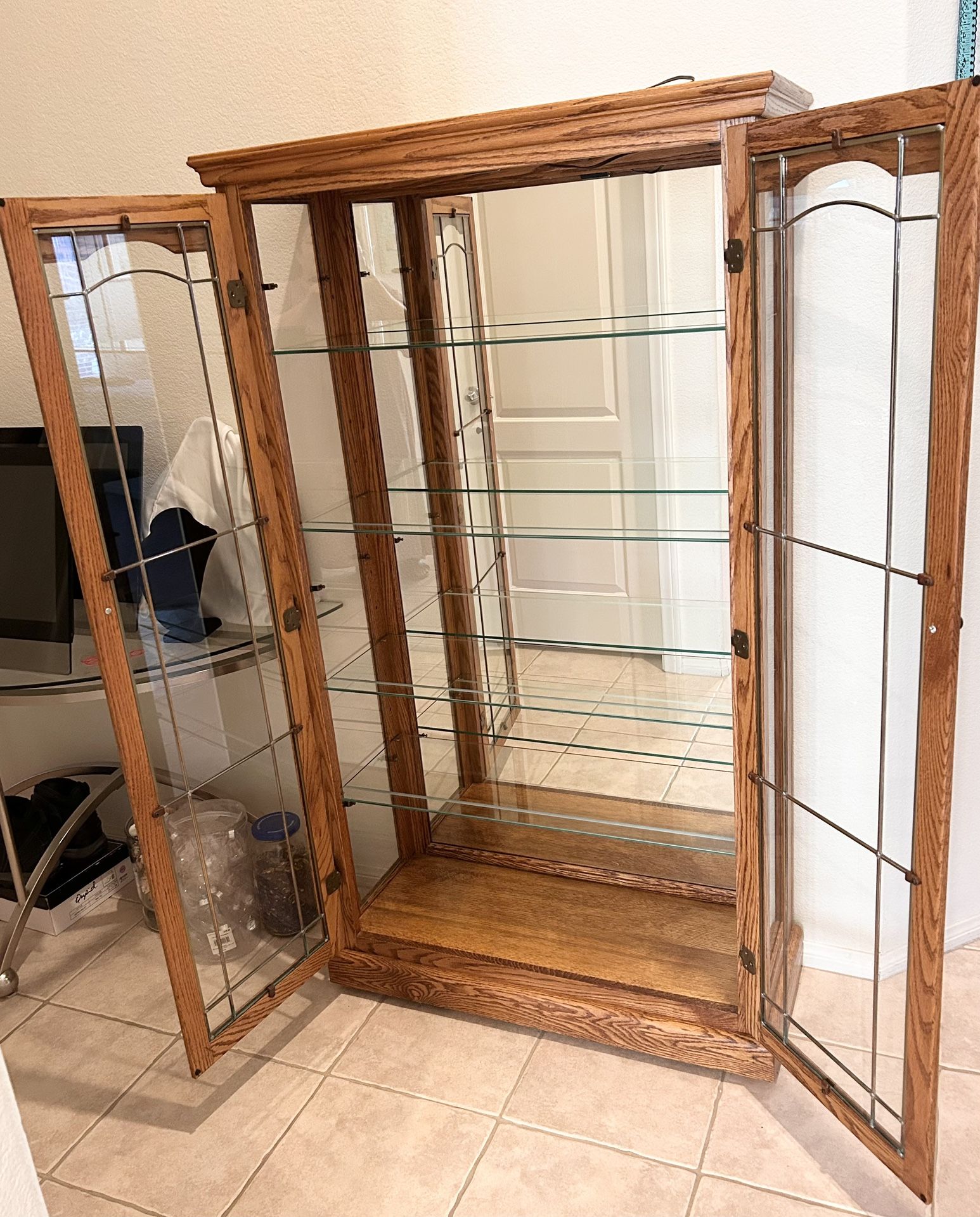 Lighted Glass Curio Cabinet.( 61.5”H x 35”W X 14”D ).