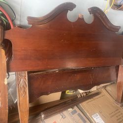 Old wooden bed frame and slats