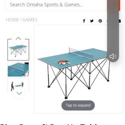 6 foot pop-up ping pong table with paddles and balls.