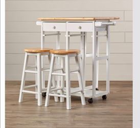 Kitchen table with stools and storage drawers