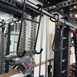 Dumbbell spotter hook