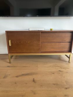 TV console brass and wood.