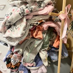 Bag of newborn clothing and NB diapers