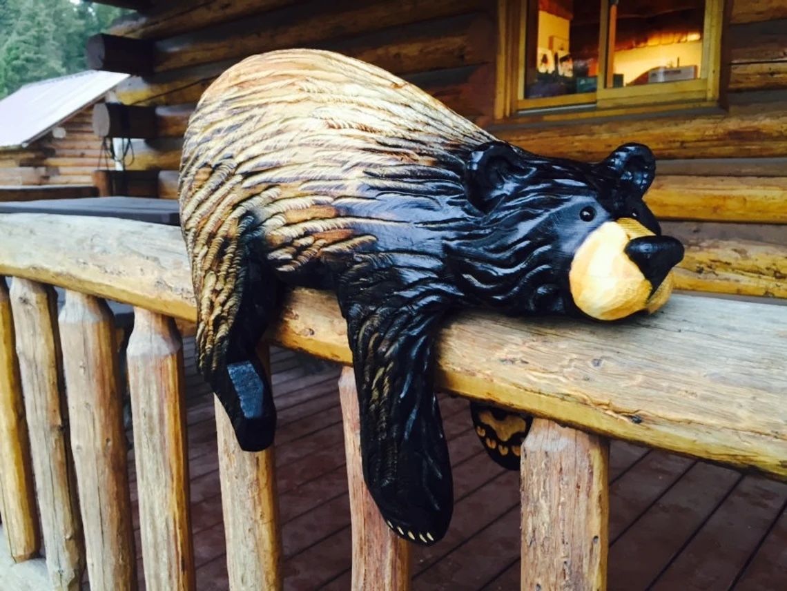 Chainsaw carved rail bear