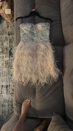 Bebe sequence and feather strapless dress
