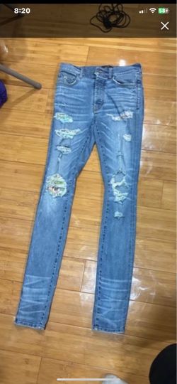 Amiri Distressed Skinny Jeans with Patches