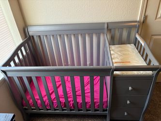 Gray Baby Crib with Changing Table and Drawers