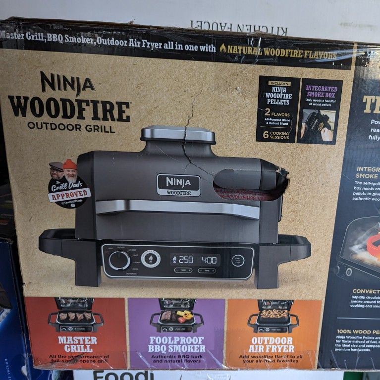 New unopened Ninja OG701 Firewood outdoor barbecue and smoker