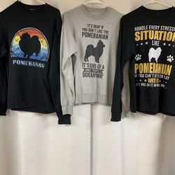 1 Black Pomeranian Rainbow Sweatshirt, 1 Black Pomeranian On Grey Sweatshirt, And 1 White Pomeranian On Black Sweatshirt.