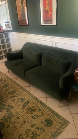 World market emerald green velvet couch