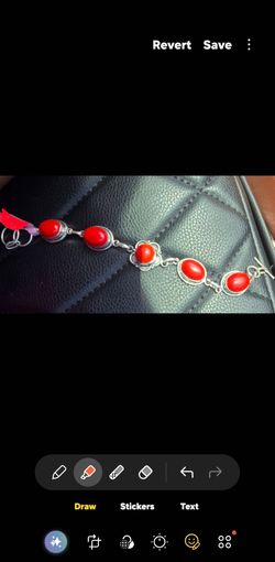 Elegant women's bracelet featuring vivid coral stones set in silver-925 links. The coral color provides a bold, eye-catching accent. Lightweight desig