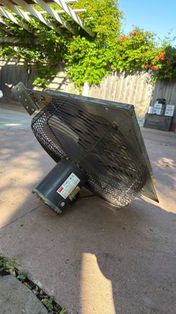 Through wall ventilation fan with louvers