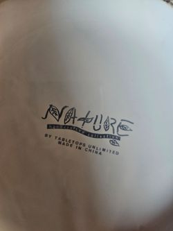 white ceramic soup tureen with embossed fruit design.