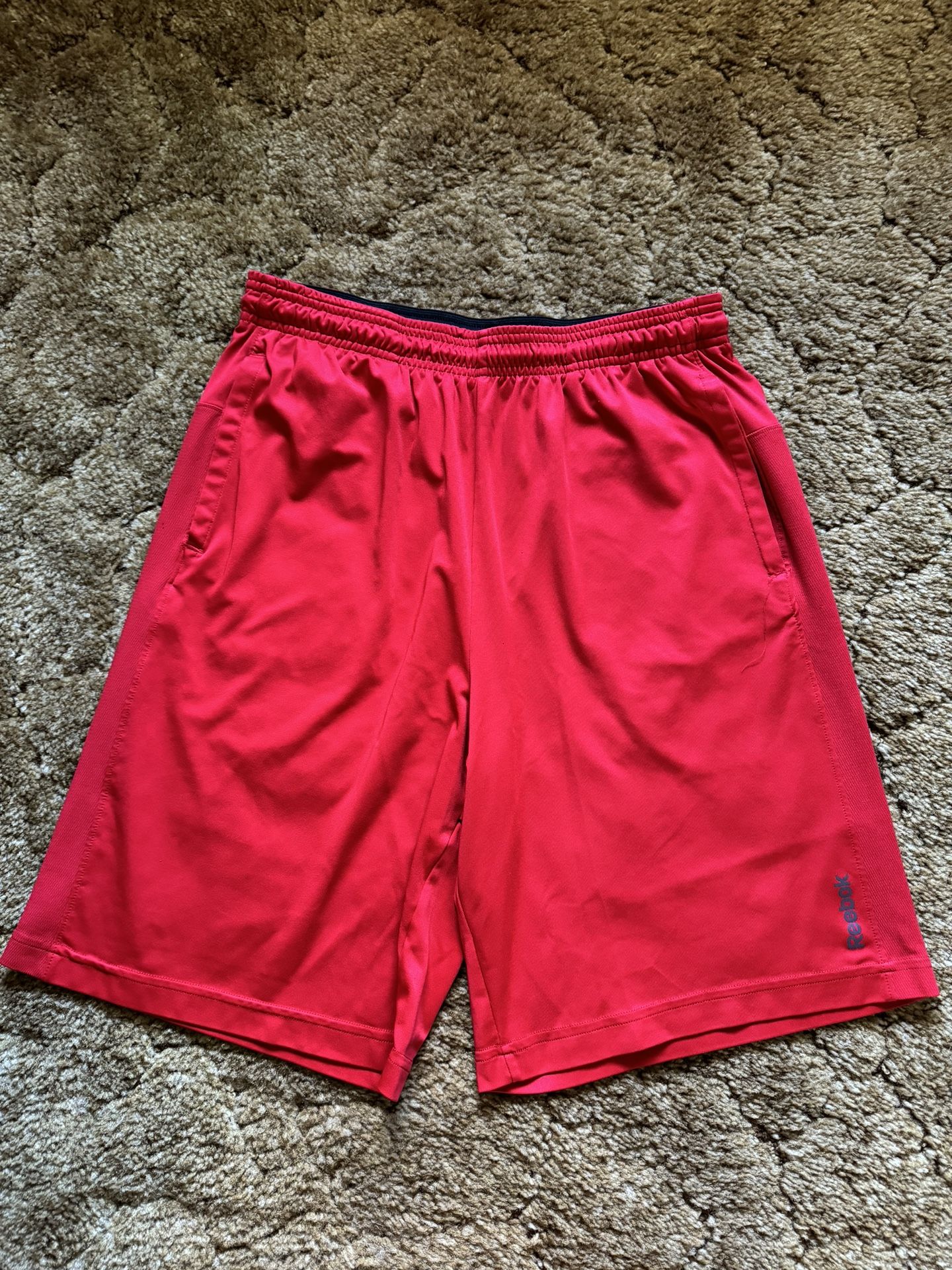 Red Reebok basketball shorts; excellent condition