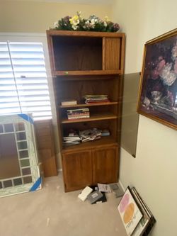 Executive desks, lateral file cabinets, book cases, pictures