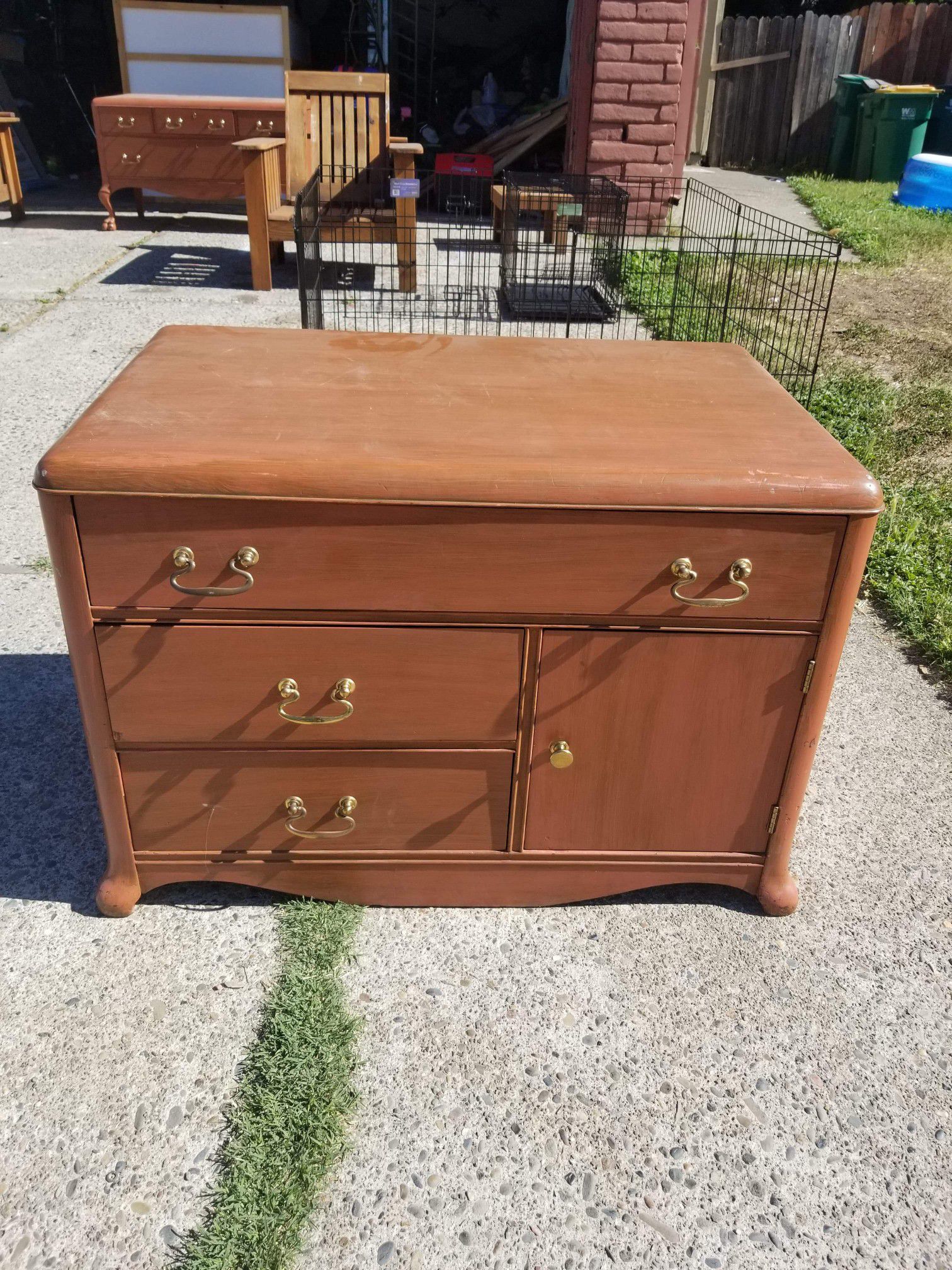 Small antique dresser. Measurements are 2 feet tall, 34 inches long 21 inches deep