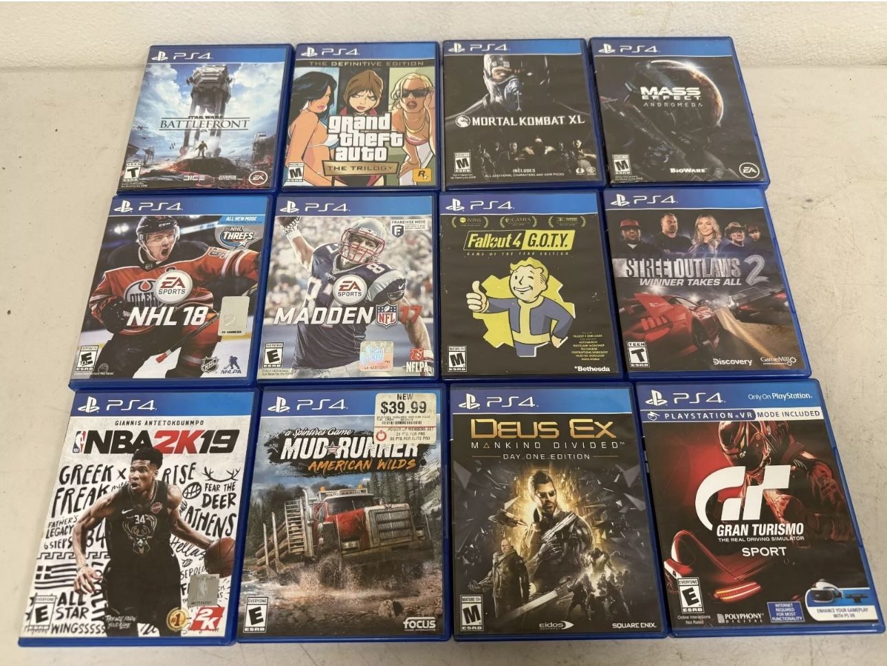Lot 12 PS4 Games GTA, Battlefront,NHL 18, Madden, Deus Ex, Gran Turismo & Other
