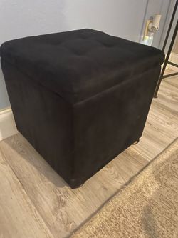 Black storage ottoman