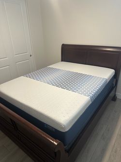 Solid Sleigh Bed ( Cherrywood ) with newer mattress and box spring.
