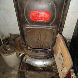 Vintage cast iron wood burning potbelly parlor stove
