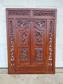 Hand-Carved Wooden Door Panel with Floral Scrollwork