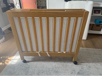 Crib with an additional mattress.