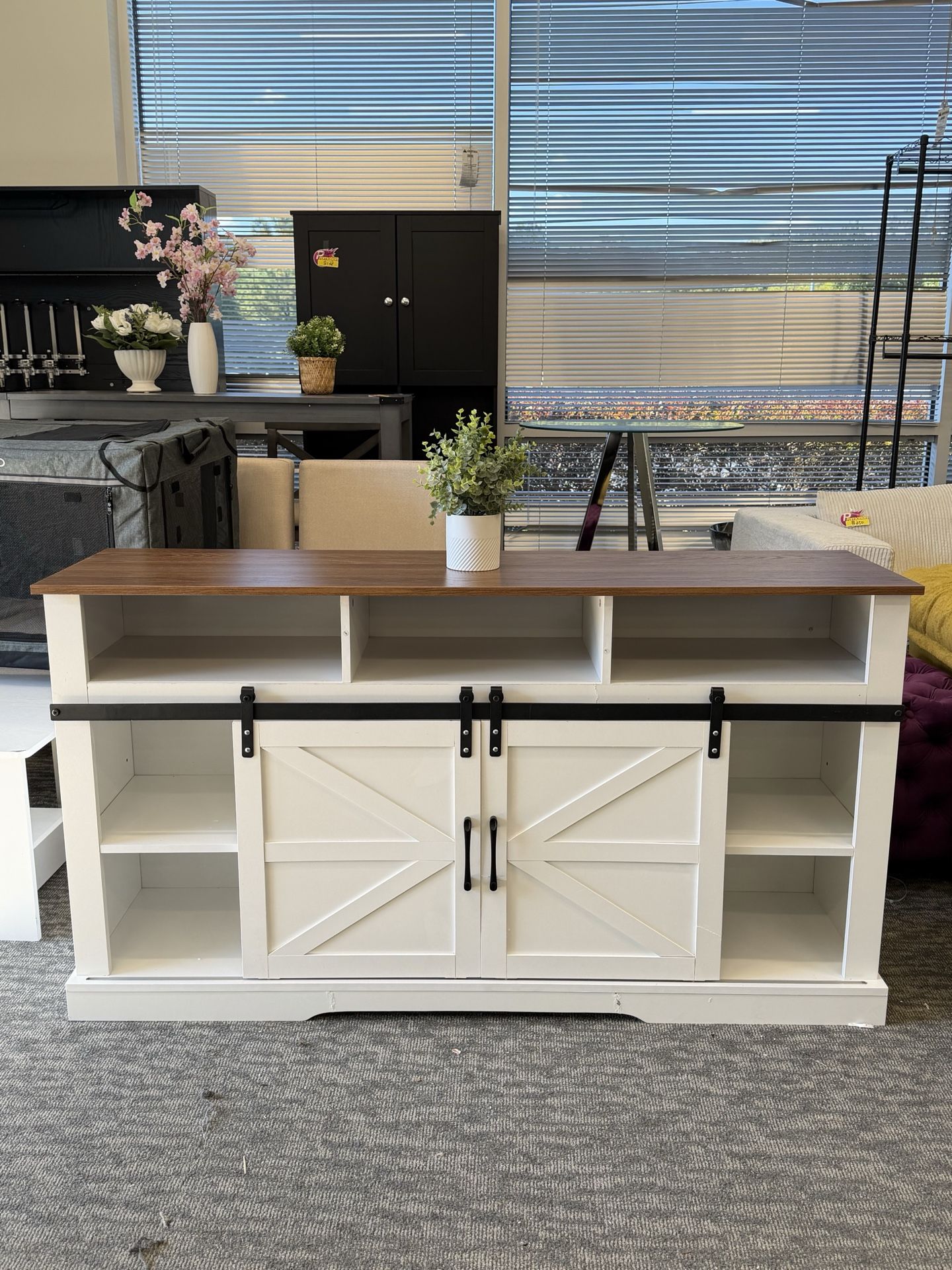 ✨58” Modern Farmhouse TV Stand✨ Fits TVs up to 65”. Features sliding barn doors, adjustable shelves, and a sturdy wood frame with a clean white finish